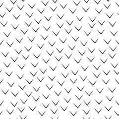 A black and white geometric pattern with repeating V-shaped elements arranged diagonally. Seamless pattern.