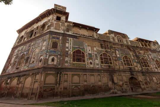 View of historic building with fading colors and intricate designs, standing as a testament to time's passage and architectural beauty, Lahore, Punjab, Pakistan.