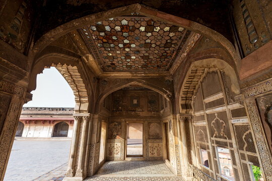 View of the ornate interior with geometric ceiling and detailed wall carvings, a glimpse into the past, Lahore, Punjab, Pakistan.