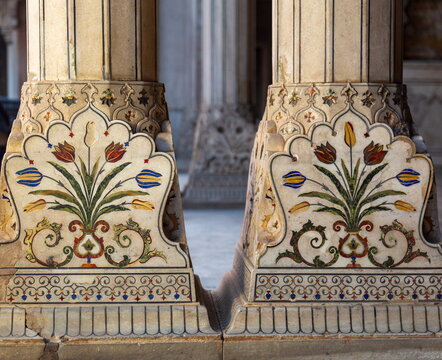 View of ornate pillars adorned with floral motifs and intricate patterns, standing as silent witnesses to history and culture, Lahore Fort, Punjab, Pakistan.