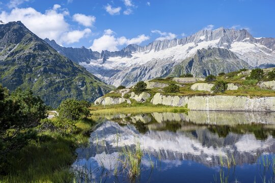 Picturesque mountain landscape, dammastock and damma glaciers reflected in Moorsee, G&ouml;scheneralp, Canton of Uri, Switzerland