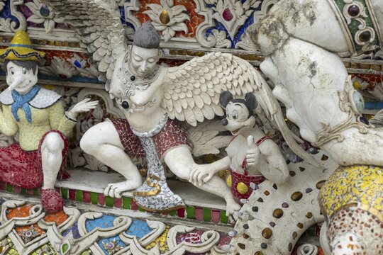 Decorative elements with pop culture references (for example comics, superheroes) in the stucco and porcelain vases outside and inside the art hall with modern art trends such as minimalism and abstraction, Wat Pariwat, Yan Nawa district, Bangkok, Thailand