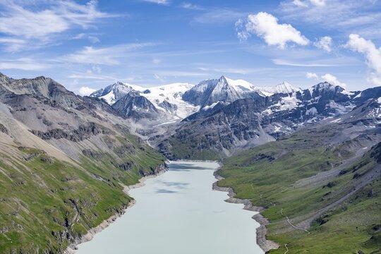 Blue mountain lake in a mountain landscape with glaciers, Lac des Dix reservoir and Mont Blanc de Cheilon peak, Valais Alps, Valais, Switzerland