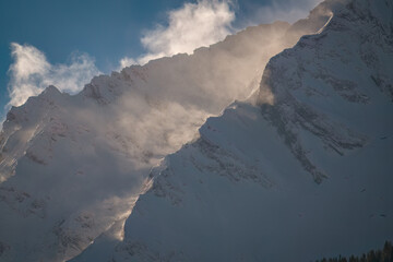 strong south wind on the alps, in the hohe tauern national park in austria, at a cold sunny winter day