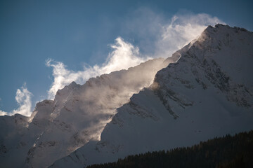 strong south wind on the alps, in the hohe tauern national park in austria, at a cold sunny winter day