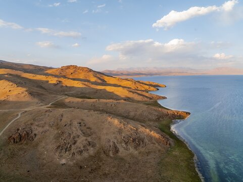 Aerial view, Vast empty landscape at the mountain lake Song Kul, Moldo Too Mountains, Naryn region, Kyrgyzstan