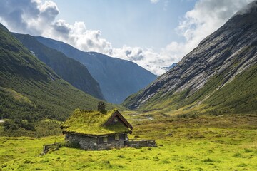 Traditional cottage with grass roof in mountain valley, Skjerdingsdalssætra, Stryn, Norway