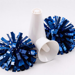 A cheerleading megaphone and pom-poms on a white backdrop