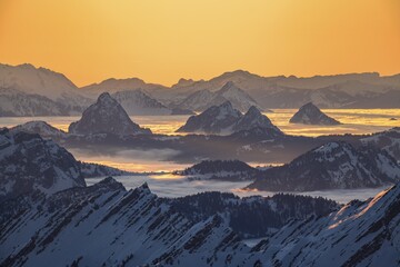 View from the Säntis to the mountains of Central Switzerland, mountain peaks rising from the sea of fog, evening mood, Alpstein, Appenzell, Switzerland