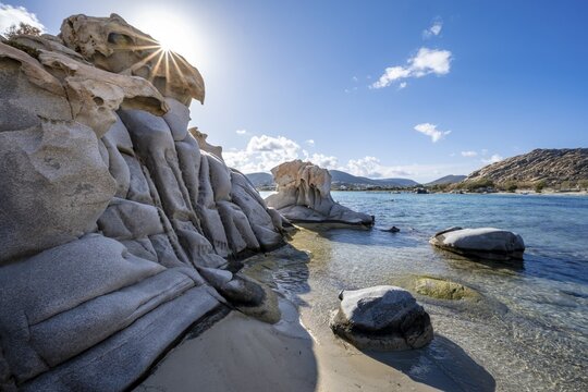 Rock formations on the coast with turquoise sea, Sun Star, Kolimbithres beach, Paros, Cyclades, Aegean Sea, Greece