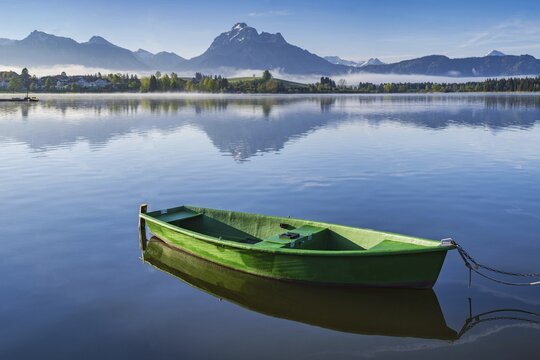 Green rowing boat, Hopfensee, Hopfen am See, near F&uuml;ssen, Ostallg&auml;u, Allg&auml;u, Bavaria, Germany