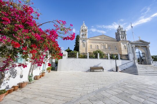 Church of Agia Triada with red bougainvillea, picturesque alleys of the village of Lefkes, Paros, Cyclades, Greece