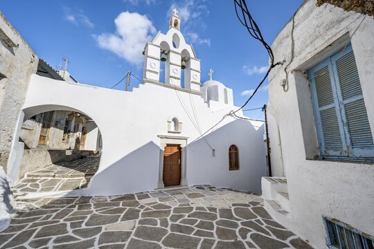 White Greek Orthodox Church, picturesque alleys of the village of Marpissa, Paros, Cyclades, Greece