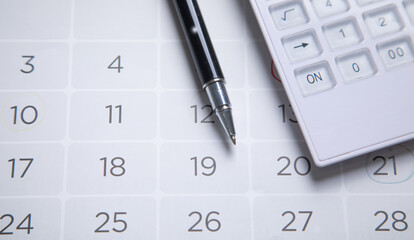 Pen on calendar. Day. Business