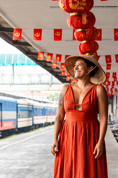 Woman exploring Hanoi train station with lanterns