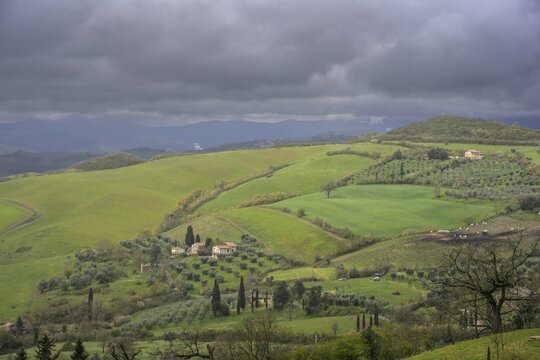 View from Piazza Matteotti on green hills after a thunderstorm, San Casciano dei Bagni, province of Siena, Italy