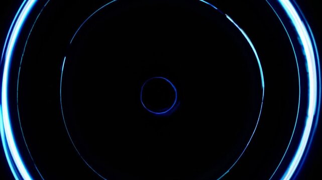Abstract futuristic animation of glowing blue and cyan concentric circles pulsing and radiating on a black background, creating a hypnotic effect