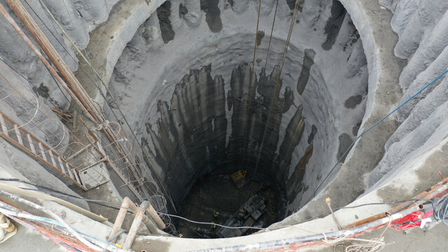 Shaft construction site with deep excavation view
