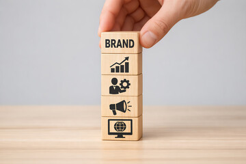 Building a Strong Brand Identity Concept with Vertical Stack of Wooden Blocks Featuring Business Growth and Marketing Icons