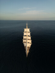 Top‑Down Drone View of Sailing Ship on Open Sea © Sam Hayen