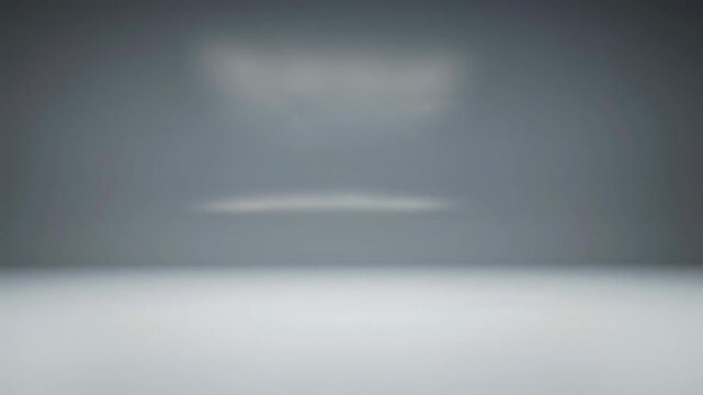 slow camera movements exploring an empty, modern light gray studio cyclorama, highlighting seamless coved walls, vast copy space, and diffused lighting. Concept of versatility and potential