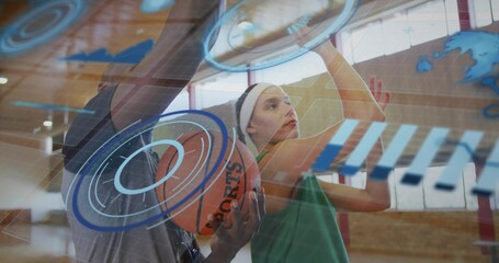 Jumping player in green jersey white headband reaching hoop at gym with SPORTS ball, AR overlays
