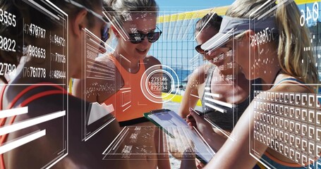 Planning, four athletes in tanks leaning over clipboard or tablet at sand court, yellow net, HUD dat