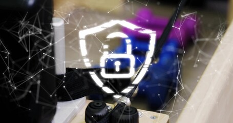 Displaying glowing shield with padlock overlay on workbench, showing network mesh and knobs