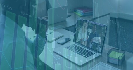 Displaying laptop showing 2 presenters on call at office, blurred in dark jacket, charts