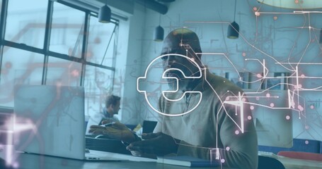 Working mature man wearing light sweater using laptop and smartphone at office with Euro overlay