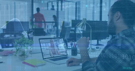 Working bearded man in plaid shirt watching remote call on laptop at open-plan office, copy space