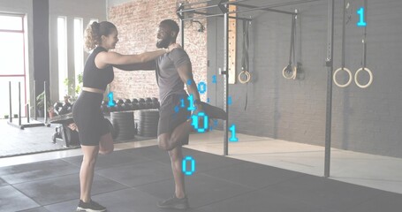 Stretching partners performing quad stretch in gym, wearing black shorts, showing binary overlay