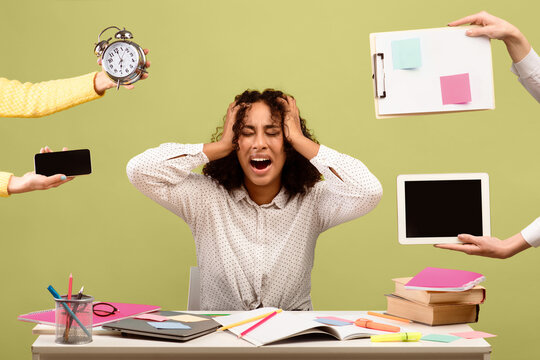 A woman is overwhelmed at her desk while people offer her various items and reminders. She covers her ears and shows her frustration with the workload and the noise around her.