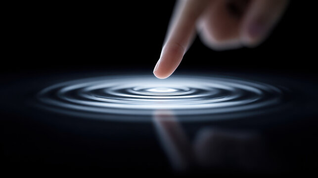 Finger touching water surface creating ripple effect symbolizing digital intelligence and innovation shaping future of literacy