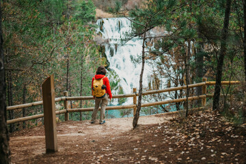 Woman enjoying a scenic hike along a nature trail