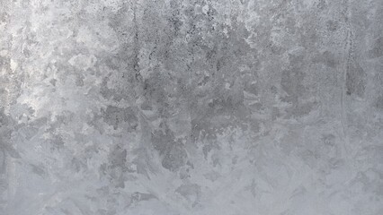 Obraz premium Frosty patterns on glass of rectangular vertical shape