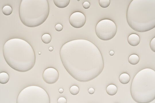 Transparent gel drops on a smooth surface background