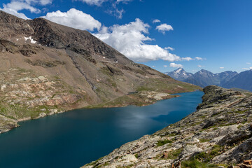 Scenic mountain landscape with an alpine lake in the Grandes Rousses massif, French Alps