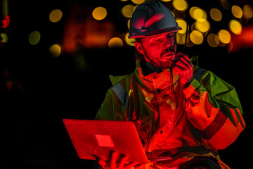 Safety officer communicating with rescue team via radio during crisis. Emergency engineer managing...