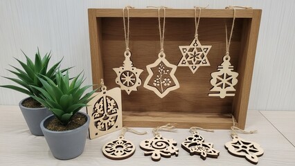 Wooden Christmas ornaments and plants on a wooden table