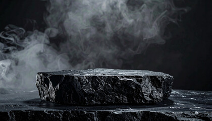 Rugged black stone display podium on dark abstract smoky background, masculine product showcase