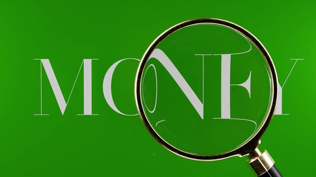 magnifying glass hovering over tex saying money, finance, wealth