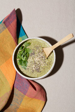 Healthy green smoothie with seeds and herbs