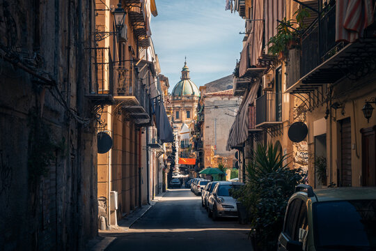 Narrow street with dome view in Palermo