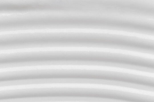 White cream texture background in wavy pattern