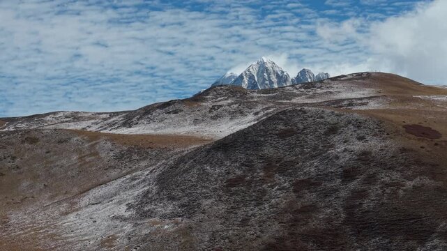Drone Reveal Shot of Yala Snow Mountain in Winter
