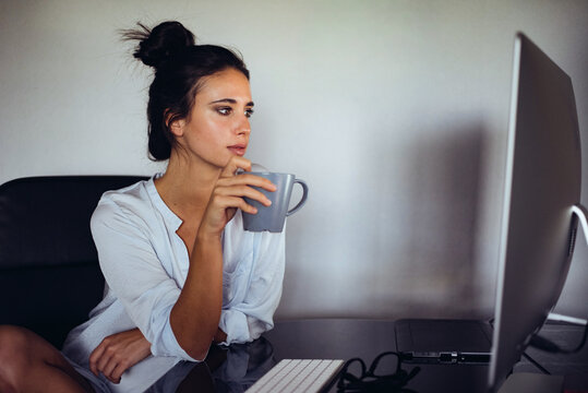 Woman enjoying a quiet moment at home with coffee