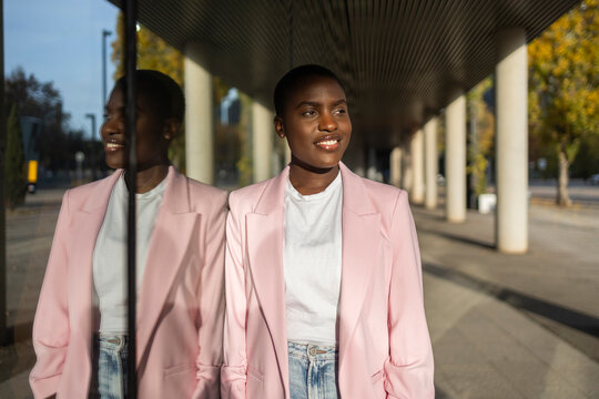 Confident african businesswoman in pink jacket