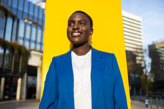 Confident African businesswoman in a blue blazer