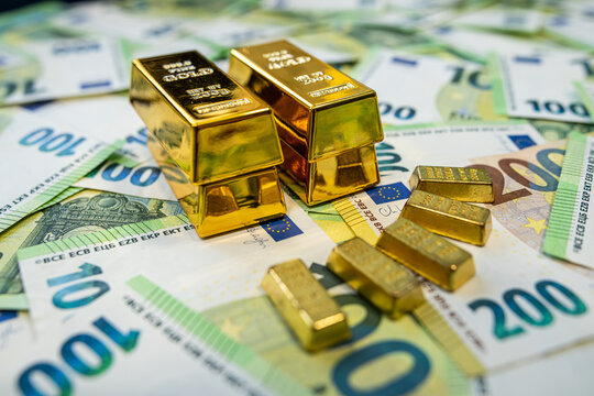 Stack of gold bars on euro banknotes representing wealth, fortune and long term financial growth